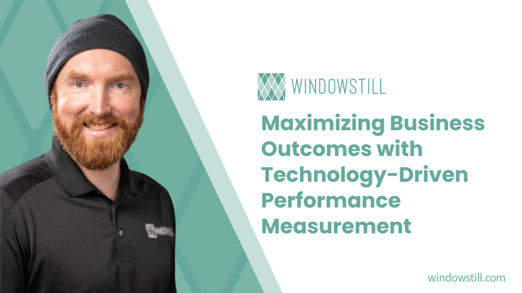 Man presenting on maximizing business outcomes with technology-driven performance measurement.